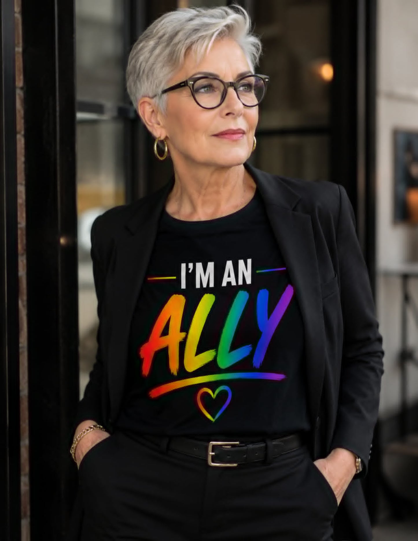 Person wearing a black t-shirt with 'I'm an Ally' text in colorful letters.