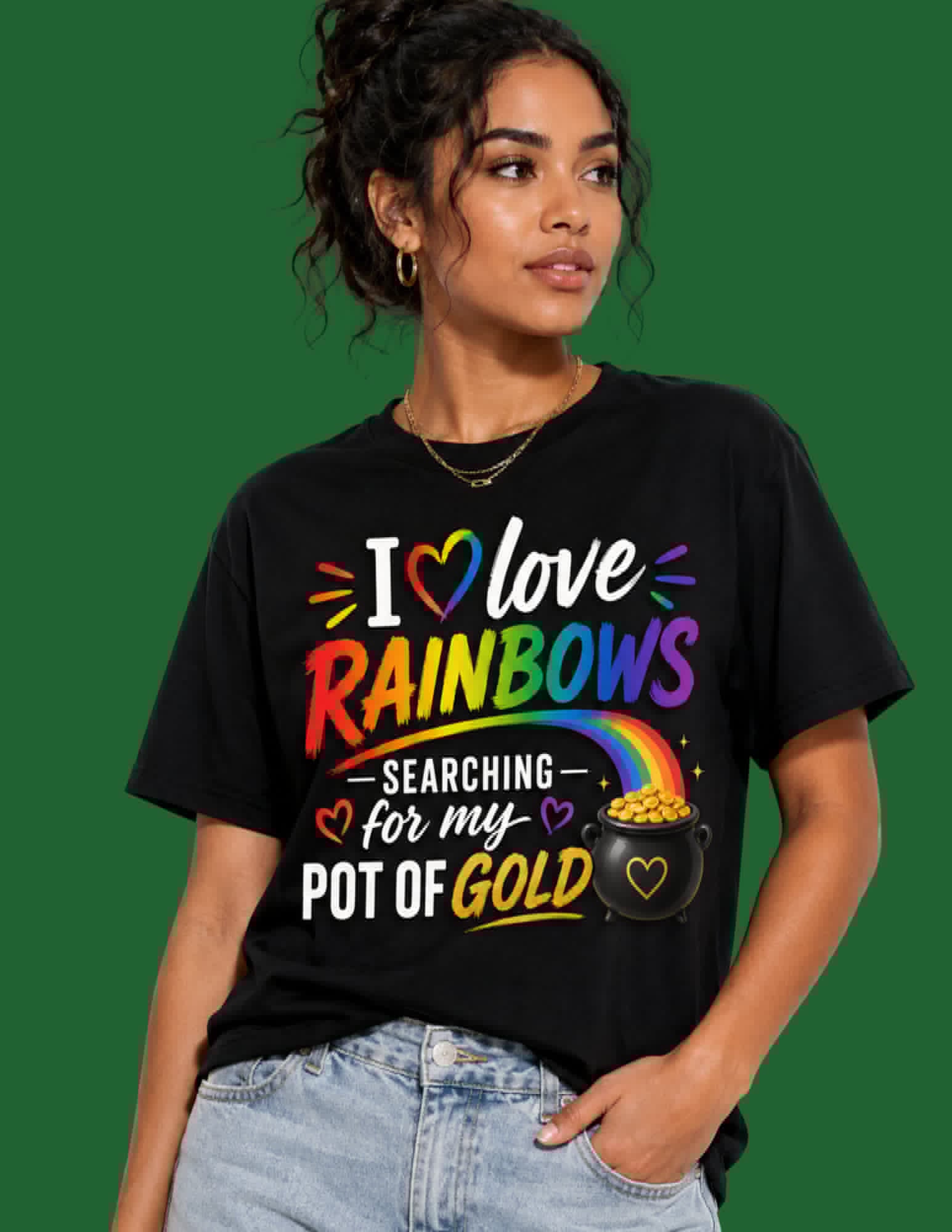 Person wearing a black t-shirt with colorful text and graphics on a green background